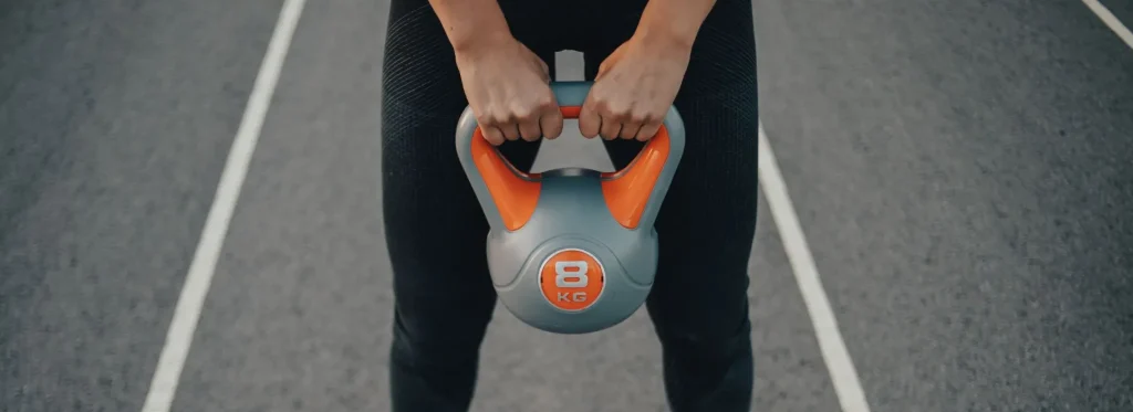 Person holding kettlebell