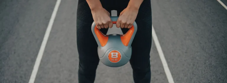 Person holding kettlebell